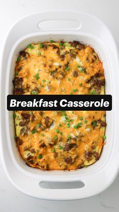 a casserole dish with meat, cheese and green onions in it on a white surface