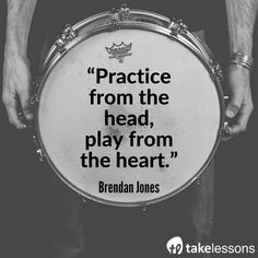 a man holding a drum with the quote practice from the head, play from the heart