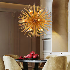 a dining room table with chairs and a chandelier hanging over it's head