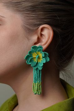 Big Beaded Flower Earrings with Long Tassel Fringe Earrings This summer, make it a memorable one with these carefully handmade colourful bead flowers. All made with attention to detail, this design is sure to captivate any onlooker. Wear it with summer dresses, linen suits or even bikini while enjoying the carefree summer breeze. Big Floral, Earrings Bead, Earrings Big, Long Fringe, Long Fringes, Earrings Bridesmaid, Jewelry Design Earrings, Earrings Beaded, Big Flowers