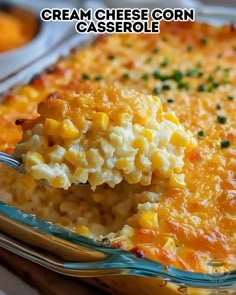 a spoon full of macaroni and cheese casserole with the words cream cheese corn casserole