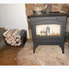 a wood burning stove sitting next to stacks of logs