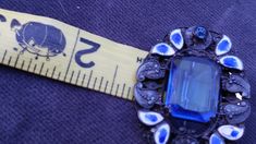 Lovely brooch with deep blue colors. Designed with blue enamel guilloche leaves and small glass accents. Small amount of wear in pin backing. On the first picture top right there is a small amount of wear to the blue of the enamel but the white is still intact. Great working clasp. Good vintage condition with very little wear. Center stone is open work and prong set where the chaton accents on the sides are bevel set into the piece. This line was designed by Neiger Brothers and showcases the uni Formal Blue Enamel Brooches, Antique Blue Enamel Brooches, Bohemian Art, Sterling Silver Brooch, Enamel Brooch, Silver Art, Silver Brooch, Silver Blue, Deep Blue