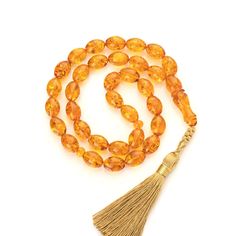 Unique and One of kind Muslim Rosary from Baltic Amber Stone. The collectible Original rosary. Amber tasbih are assembled on a high quality strand and consist of 33 beads, 2 separators, 1 imam and unique handmade tassels. The rosary is carefully crafted from high quality amber. The rosary looks perfect and will be a beautiful accessory giving the natural energy and warmth of Amber. Tasbih gives an incredibly pleasant feeling. This special Islamic prayer beads is the perfect gift for you and love Spiritual Amber Rosary For Healing, Amber Spiritual Rosary For Healing, Amber Spiritual Healing Rosary, Traditional Amber Rosary With 8mm Beads, Amber Rosary With 8mm Beads In Spiritual Style, Amber Rosary With 8mm Beads, Spiritual Style, Amber Rosary With 8mm Beads, Spiritual Amber Rosary With 8mm Beads, Amber 8mm Beads Spiritual Rosary