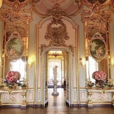 an ornately decorated hallway with gold trim