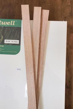 two pieces of wood sitting next to each other