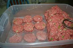 some meat patties are in a plastic container