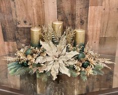 a glass table topped with candles and flowers