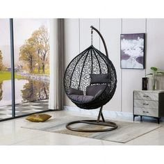 a hanging egg chair in a living room