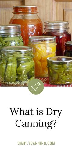 jars filled with pickles and other vegetables on top of a table next to the words what is dry canning?