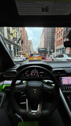 the interior of a car with many cars driving down the street in front of it