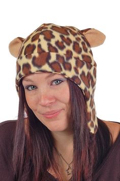 a woman with long hair wearing a leopard print hat