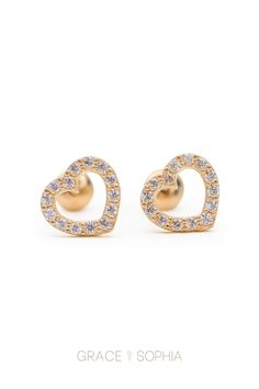 These timeless open heart cubic zirconia stud earrings are made with 18 karat gold, so they'll last a lifetime for your little one. We're having a holiday sale on November 26th. Enjoy 30% off everything! #goldjewelry #childrensjewelry #jewelry #kidsjewelry #14kyellowgold #goldheartearrings #kidsearrings #cubiczirconia #childrensfashion Gold Heart Earrings With Prong Setting, Gold Cubic Zirconia Pierced Heart Earrings, Fine Jewelry Gold Heart Diamond Earrings, Gold Heart Earrings With Cubic Zirconia, Yellow Gold Cubic Zirconia Heart Earrings For Pierced Ears, Gold Double Heart Cubic Zirconia Earrings, Hypoallergenic Yellow Gold Open Heart Earrings, Gold 14k Open Heart Earrings, Gold Heart-shaped Diamond Earrings