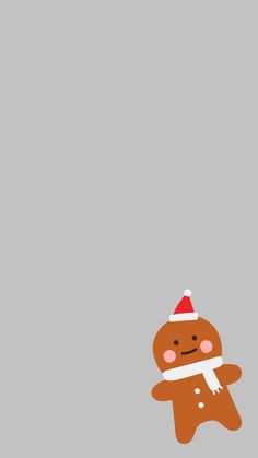 a ginger with a santa hat and scarf is standing in front of a gray background