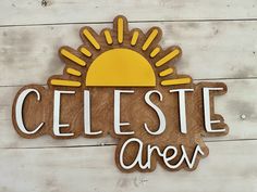 a wooden sign with the words celeste area painted in white and yellow on it