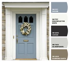 a blue front door with white trim and wreath on it, next to the color swatches