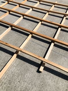 wooden slats sitting on top of concrete