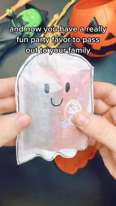 someone is holding up a paper cutout with a ghost face on it and the caption says, and now you have a really fun party for to pass out your family