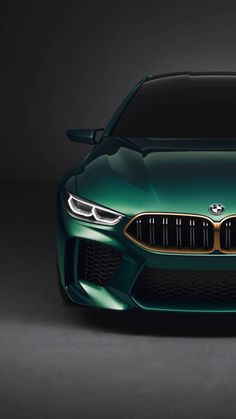 the front end of a green bmw concept car