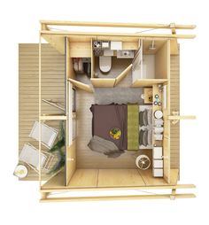 an overhead view of a bedroom and bathroom in a tiny house with wood flooring