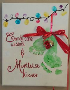 a handprinted christmas card with candy cane wishes and mittens kisses on it