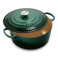 a green casserole with a brown lid