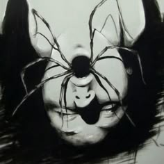 a black and white drawing of a spider on the face of a person's head