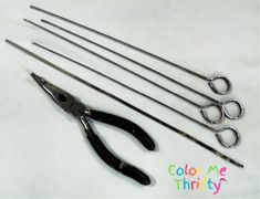 there are several pairs of scissors and pliers next to each other on a white surface