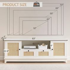 a white entertainment center with wicker doors and drawers in front of a wall size chart