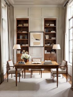 a living room filled with furniture and bookshelves