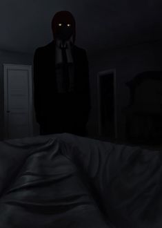 a person in a dark room with a creepy mask on