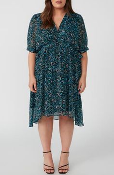 A dainty floral print adorns this dress crafted with elbow-length sleeves and an asymmetric, tiered ruffle hem. 42 1/2" length (size 16) Hidden back-zip closure V-neck Short sleeves Partially lined 100% polyester Machine wash, dry flat Imported Blue Floral Print Tiered Dress, Blue 3/4 Sleeve Dress With Ruffles, Blue Short Sleeve Tiered Dress With Ruffle Hem, Blue Short Sleeve Tiered Dress For Spring, Ruffle Floral Dress, Black Print Dress, Womens Shift Dresses, Dress Crafts, Floral Blue Dress