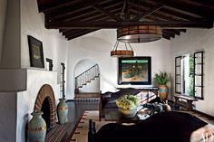 a living room filled with furniture and a fire place