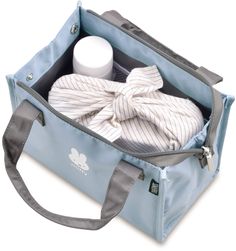 an open blue bag with items in it on a white background and a gray strap