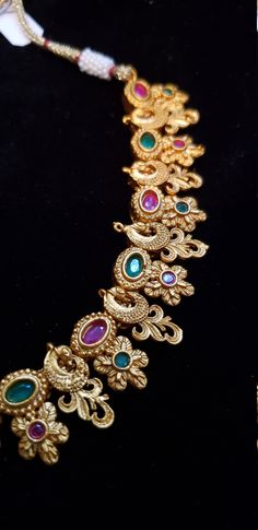 "Handmade Indian Temple Jewelry, best to wear it for traditional ceremonies or Indian wedding. This bridal jewelry has ethnic finish. It has Cubic Zircon stones with ruby and emeralds. It is a Bollywood style one gram jewelry. There are long and short patterns of Indian jewelry in Kundan, Pearls, CZ, American Diamond , ruby, emerald, Polki, kemp to suit every occasion of South Indian and North Indian weddings. Handmade Indian Jewelry item * Stunning Hand made Traditional jewelry set. * Necklace Brides Jewelry, Jewelry Emerald, Temple Jewelry, Indian Temple, Bollywood Style, Tassels Fashion, Jewelry Pearl, Ruby Emerald, Indian Wedding Jewelry