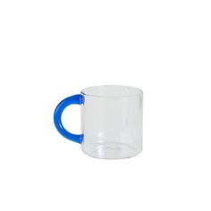 a blue and clear coffee mug on a white background with the bottom half painted bright blue