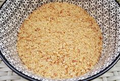 a bowl filled with oatmeal sitting on top of a wicker table