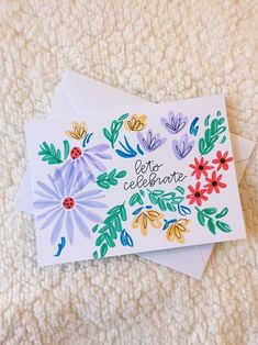 two greeting cards with colorful flowers and the words ceeto celebrate written in spanish on them