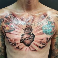 a man with tattoos on his chest has a heart and crown tattoo on his chest