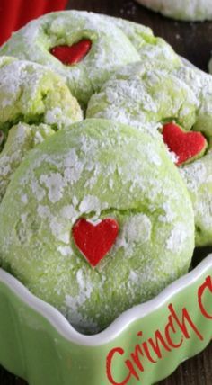 some heart shaped cookies in a green bowl