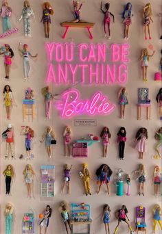 there are many barbie dolls on the wall