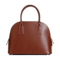 The Row Nina Cherry Wood Calf Leather Shoulder Bag. Cherry calf leather, handles on the top, zipper closure with leather puller, embossed logo on the front, detachable branded mini-pouch, lined. Celebrity Siblings, Zegna Shoes, Celebrity Kids, Mini Pouches, Marine Serre, Sneaker Wedge, Leather Handles, Cherry Wood, Embossed Logo