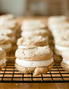 cookies and cream sandwiches are cooling on a wire rack, ready to be baked or eaten