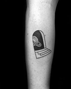 a black and white photo of a person's leg with a tattoo on it