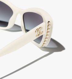 PERFECT FOR: BACHELORETTE, BRIDAL SHOWER, WEDDING & HONEYMOON! $520 retail These authentic Chanel white acetate sunnies feature white glass pearls, a gold-toned Chanel logo at each of the temples with gray, gradient lenses that provide 100% UVA and UVB Protection CE (UV Category Filter 3). Frame width: 128 mm Lens Height: 40 mm Lens Width: 56 mm Temple Length: 140 mm Chanel Ref #:5481H 1255/S6, A71491 X08222 S5512, Made in Italy Delivery available in 4-6 business days. Need it sooner? Email us at Admin@BorrowMeBridal.com! Chanel Sunglasses Cat Eye, Chanel Pearl Sunglasses, Pearl Sunglasses, Chanel Glasses, Sunglasses Cat Eye, Chanel White, Chanel Store, White Sunglasses, Fashion Chanel