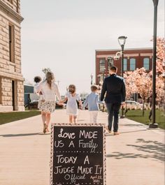 a chalkboard sign that says don't made us a family today, a judge made it one last