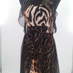 Black And Beige Animal Print Gown Black Sheer Flowy Overlay Embellished With Black Beads Stretchy Fabric Black Beige & Carmel 100% Viscose Size: Small New With Tags From Smoke Free, Pet Free Environment Fast Shipper Elegant Leopard Print Dress For Party, Elegant Leopard Print Party Dress, Elegant Leopard Print Maxi Dress For Parties, Elegant Leopard Print Maxi Dress For Evening, Sleeveless Leopard Print Evening Dress, Chic V-neck Dress With Zebra Print, Black V-neck Dress With Zebra Print, Black Zebra Print V-neck Dress, Black And Tan