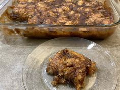 a glass dish filled with food next to a casserole dish