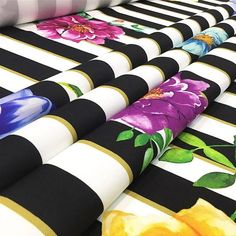 colorful flowers on black and white striped fabrics