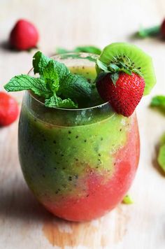 a fruit smoothie with kiwi, strawberries and mint